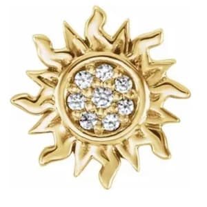 May include: A gold sun charm with a cluster of small diamonds in the center.