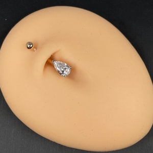 14karat Solid Gold Bellybutton ring- Pear-shaped zirconia 8x5mm Two tone 14 karat yellow and white gold navel ring.