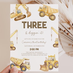 May include: Construction themed birthday party invitation with yellow and brown watercolor illustrations of construction vehicles. The text reads "THREE & diggin' it! Let's dig up some fun for Cameron's third birthday! Saturday, October 8th 2:00 PM The Smiths' Residence 17 Stonebridge Way | Morrison, CO RSVP by 9/23 to Linda @ 123-456-7890"