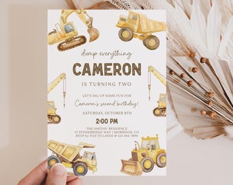 May include: A rectangular birthday invitation card featuring yellow construction vehicle illustrations including an excavator, dump truck, and crane. The text reads: dump everything CAMERON IS TURNING TWO LET'S DIG UP SOME FUN FOR Cameron's second birthday! SATURDAY, OCTOBER 8TH 2:00 PM THE SMITHS' RESIDENCE 17 STONEBRIDGE WAY | MORRISON, CO RSVP BY 9/23 TO LINDA @ 123-456-7890.