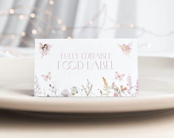 May include: A rectangular white food label featuring the text FULLY EDITABLE FOOD LABEL in thin lettering. The design includes watercolor illustrations of two small fairies, two butterflies, and a variety of wildflowers in soft pink and green tones.
