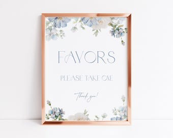 May include: A rectangular sign in a metallic copper frame featuring blue and white floral illustrations at the top and bottom corners. The text reads FAVORS, PLEASE TAKE ONE, and Thank you! in a dark blue, thin, elegant serif font.