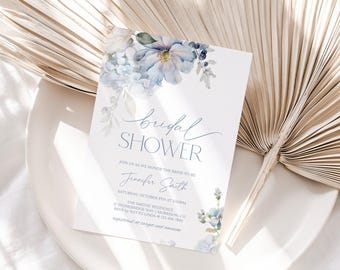 May include: A white rectangular bridal shower invitation card featuring watercolour blue flowers at the top and bottom. The text reads: bridal SHOWER, JOIN US AS WE HONOR THE BRIDE-TO-BE, Jennifer Smith, SATURDAY, OCTOBER 8TH AT 2:00PM.