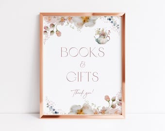 May include: A framed sign with a rose gold border. The sign reads "BOOKS & GIFTS" in a soft pink font, with floral watercolor accents. A small teapot illustration is at the top. The words "Thank you!" are at the bottom.