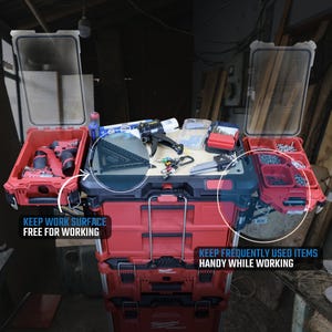 May include: A red and black tool box with a clear lid. The box is stacked on top of another red and black tool box. The top box has a label that says "Keep work surface free for working". The bottom box has a label that says "Keep frequently used items handy while working".