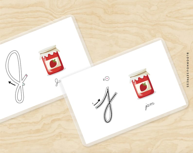 May include: Tracing worksheet for the lowercase letter 'j' with a dotted line path and an arrow showing the direction to trace. The letter 'j' is written below the tracing line. An illustration of a jar of jam with a strawberry on top is shown next to the letter.