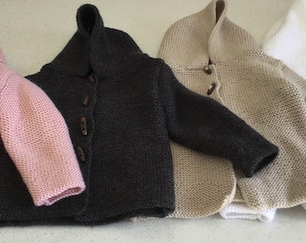 Toddlers jumpers, jackets and pram blankets.