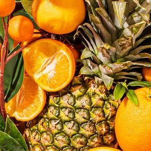 May include: A vibrant still life featuring fresh oranges, tangerines, and a pineapple. The oranges are whole and sliced, showcasing their juicy interior. Green leaves and stems add a natural touch. The pineapple has a textured, green and brown exterior.
