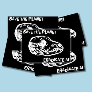 May include: A stack of rectangular black stickers featuring a white linocut-style illustration of a canine skull. The text "SAVE THE PLANET" is printed in white at the top, and "ERADICATE AI" is printed in white at the bottom of each sticker.