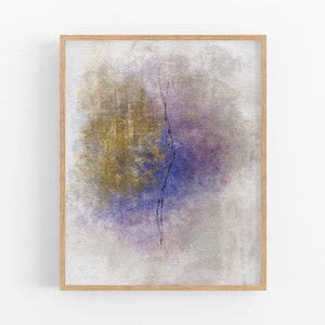 Puede incluir: Pintura abstracta en un marco de madera. La pintura presenta una gran forma circular con tonos de morado, azul y dorado. Una fina línea negra atraviesa el centro de la forma.