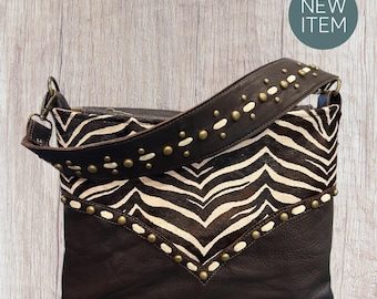 Handcrafted artisan leather shoulder bag, zebra print hair on hide, chocolate oil tan leather with antique brass spots