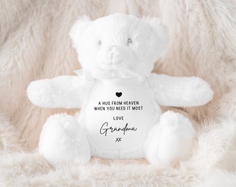 May include: White plush teddy bear with the text "A hug from heaven when you need it most. Love Grandma xx" printed on its chest.