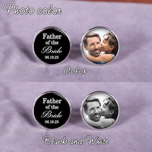 May include: Two cufflinks with a black background and white text that reads "Father of the Bride" and a date. One cufflink has a color photo of a father and daughter, and the other cufflink has a black and white photo of the same father and daughter.