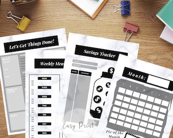 May include: A printable planner set with a black and white marble background. The set includes a weekly meal planner, a savings tracker with a jar and coins, and a monthly calendar with a space for a picture of the month.