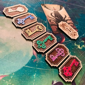 Tabletop gaming &quot;Key&quot; tokens made for the Innsmouth Conspiracy expansion for Arkham Horror LCG, engraved in maple with glitter detail
