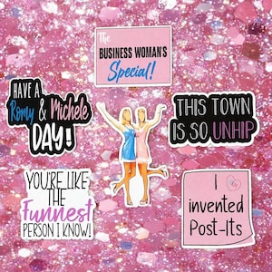 May include: A collection of six vinyl stickers featuring illustrations of two figures in dresses and various quotes including The Business Woman's Special, Have a Romy & Michele Day, This Town Is So Unhip, You're Like The Funnest Person I Know, and I invented Post-Its.