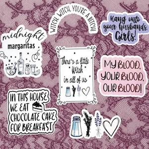 May include: A collection of seven die-cut vinyl stickers featuring black and purple text and illustrations. Designs include phrases like midnight margaritas, witch witch you're a bitch, hang onto your husbands girls, and in this house we eat chocolate cake.