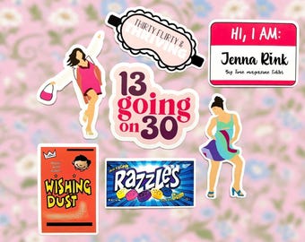 May include: A collection of six stickers featuring a pink dress illustration, a sleep mask with text "THIRTY FLIRTY & THRIVING", a name tag reading "HI, I AM: Jenna Rink", "13 going on 30" text, a "WISHING DUST" packet, and a "RAZZLES" candy package.