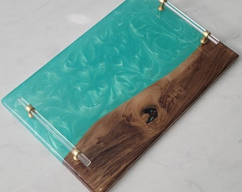 Charcuterie board with a seafoam green epoxy river