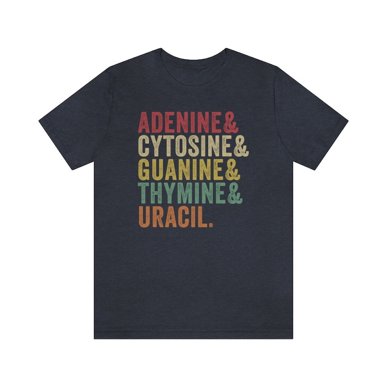 May include: A navy blue t-shirt with a vintage-style graphic that reads "Adenine & Cytosine & Guanine & Thymine & Uracil."