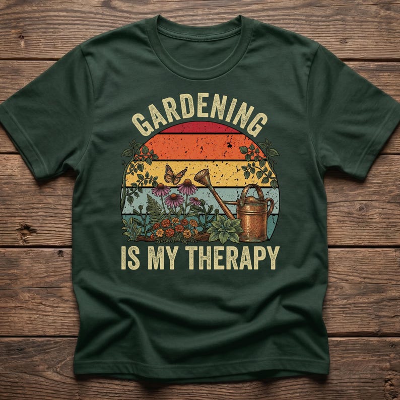 May include: Dark green t-shirt with a retro design featuring the text "Gardening is My Therapy." The design includes a sunset, flowers, a watering can, and a butterfly, perfect for gardening enthusiasts.