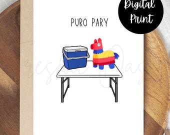 May include: A white card with black text that says "PURO PARY". There is a blue cooler and a red, yellow, and blue pinata on a black folding table.
