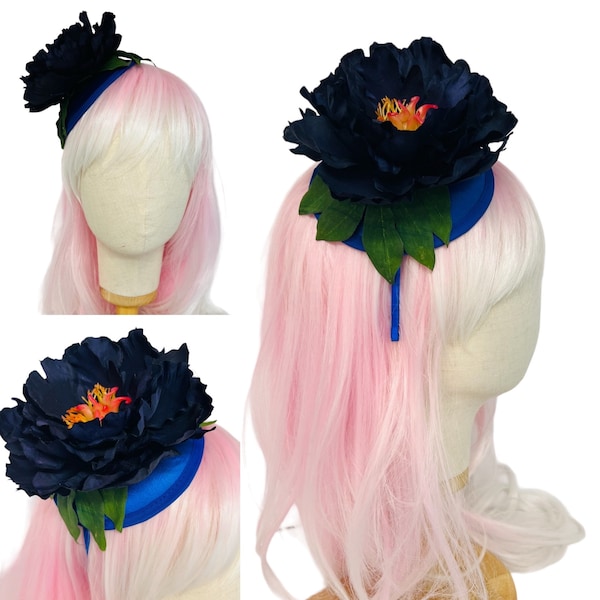 Stunning navy blue peony over sized fascinator flower hat. Set on a covered hair band. One size fits all.