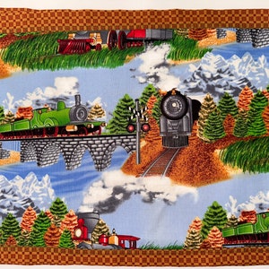 Train placemats set of 4 with brown backing fabric.
