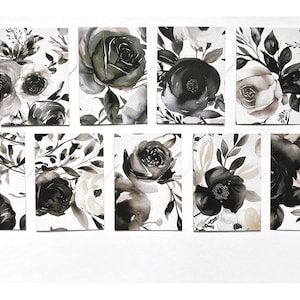 May include: Eight black and white watercolour floral print cards with a white background. The cards feature various floral arrangements with roses, anemones, and leaves.