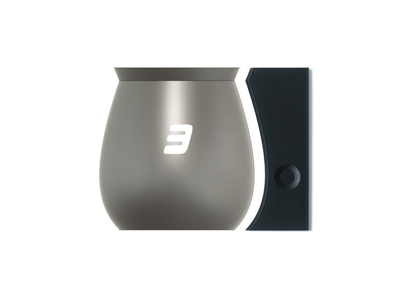 May include: A gray metal wine glass with a white number "3" on the side. The glass is next to a black wine stopper with a round opening.