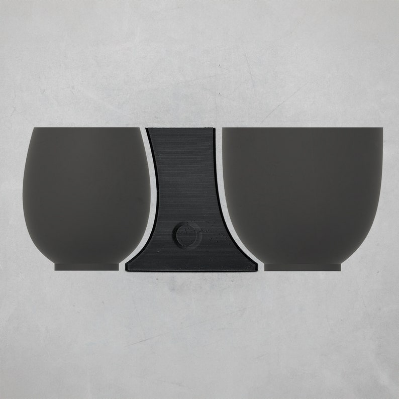 May include: Three black ceramic cups with a black stand. The cups are round and have a smooth surface.