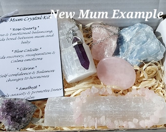May include: A white box filled with crystals and a card that reads "New Mum Crystal Kit" with descriptions of the crystals: Rose Quartz, Blue Calcite, Citrine, and Amethyst.