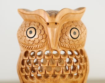 Fascinating miniature wooden owl figurine with a small baby owl inside made from a piece of boxwood - height 5 cm or 8 cm