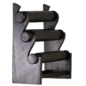 May include: A dark stained wooden jewelry display stand with three cylindrical bars for bracelets or bangles. The stand has a vertical back and a zig-zag design.