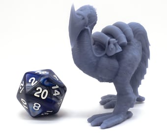 May include: A gray 3D printed miniature of a bird-like creature with a saddle and a blue and white 20-sided die.