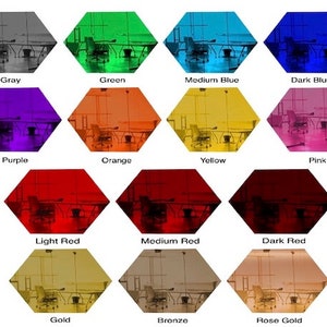 May include: A collage of 12 hexagonal images showing a room interior in different colors. Each image shows a table and chairs in the room. The colors are: gray, green, medium blue, dark blue, purple, orange, yellow, pink, light red, medium red, dark red, gold, bronze, and rose gold.