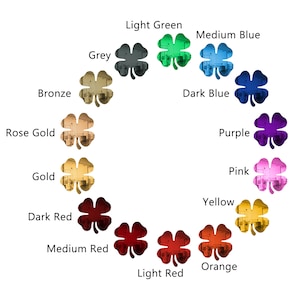 May include: A set of 12 four-leaf clover charms in various colors, including bronze, rose gold, gold, dark red, medium red, light red, orange, yellow, pink, purple, dark blue, medium blue, light green, and grey.