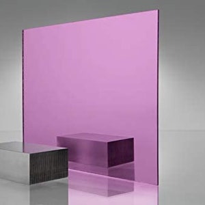 May include: A large sheet of pink mirrored acrylic.