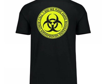 May include: Black t-shirt with a yellow circle graphic on the back. The graphic features a biohazard symbol and the text "CREW CALL 1-800-WE RAVE HARD BIOHAZARD HEADBANGER".