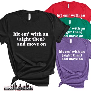 May include: A collection of t-shirts in black, red, green, and purple. Each shirt displays the phrase "hit em' with an (aight then) and move on" in white text. The shirts are from Sparkling Shirts of Atlanta.