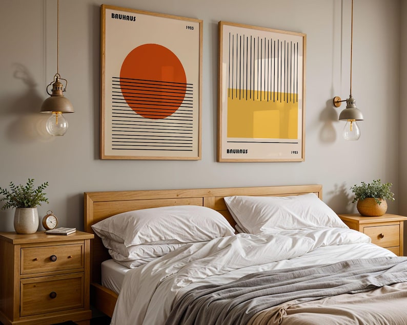 a bedroom with a large bed, wooden nightstands, and two framed abstract artworks hanging on the wall above the bed.