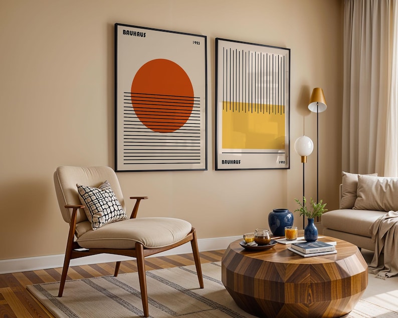a modern living room with a beige sofa, a wooden coffee table, and two framed abstract artworks on the wall.