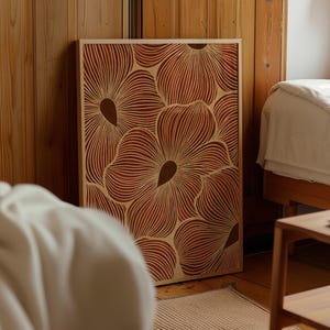May include: A rectangular wall art piece featuring a layered wood design with a repeating floral pattern. The artwork displays deep terracotta red petals with intricate, fine-lined textures and solid dark brown centers, all encased in a light wood frame.