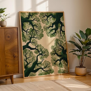 May include: A rectangular framed wall art print featuring a low-angle view of dark green tree branches and foliage extending inward from the edges against a light beige background, enclosed in a simple light-toned wooden frame.