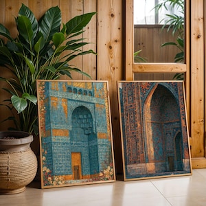 May include: Two rectangular framed wall art prints featuring detailed architectural illustrations of blue and gold tiled mosque facades with intricate geometric patterns and floral accents, displayed side by side in a wooden frame.