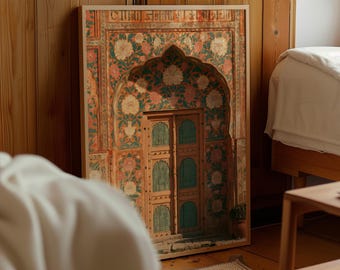 May include: A rectangular framed wall art print featuring an architectural illustration of an arched doorway. The design displays intricate floral patterns in shades of orange, green, and white, surrounding a wooden door with teal-colored panels.