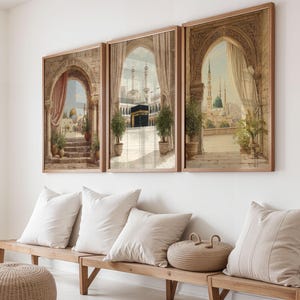 May include: A set of three framed wall art prints featuring architectural views of Islamic holy sites. Each print displays stone archways, draped curtains, and potted plants framing scenes of the Kaaba and mosques with domes and minarets.