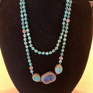 Turquoise and lapis 24 inch necklace, authentic stones beautiful condition has Marcasite surrounding the larger stones.