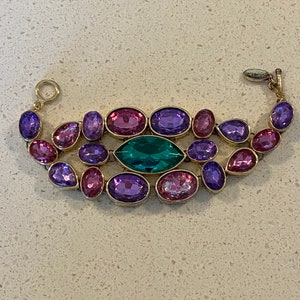 CN Scaasi stunning bracelet from the 1980’s  purple, pink & large green center. Stunning never had any repairs done..