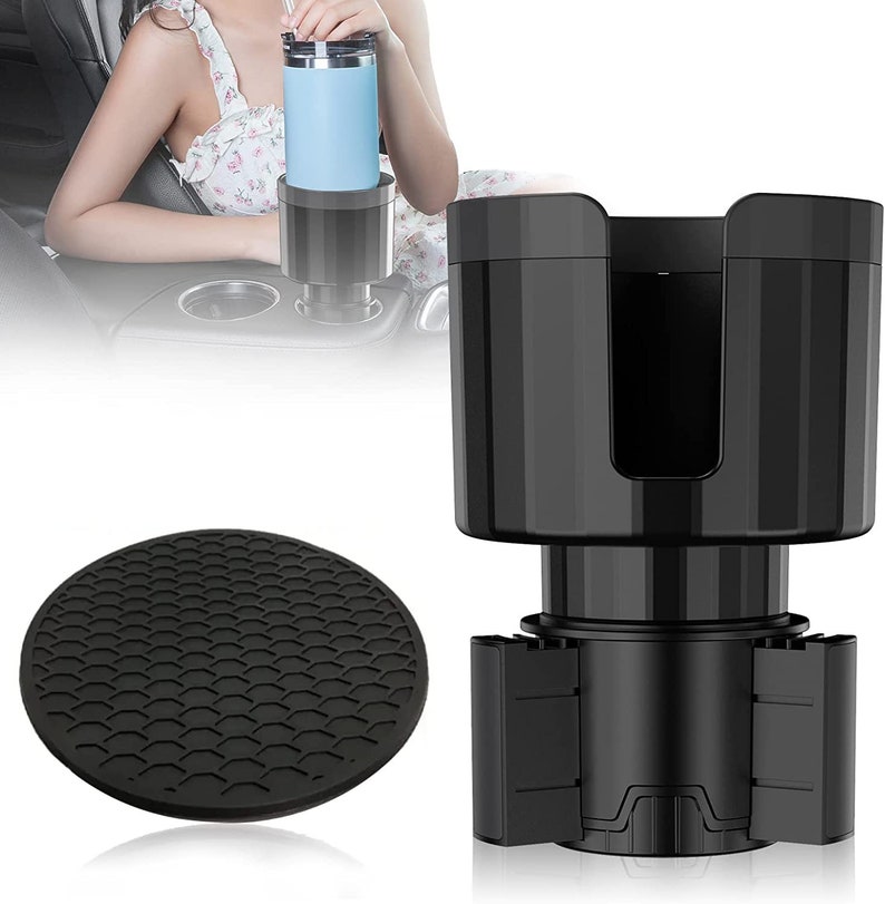 May include: Black car cup holder with a non-slip base. The cup holder has a spring-loaded mechanism to adjust to different cup sizes. The base is designed to prevent the holder from sliding around in the car.